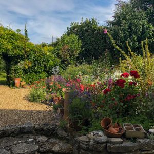 Heading outside from the kitchen you will find a country garden with table and chairs. it’s the perfect space to enjoy a meal, or perhaps drinks in the evening. Leading on from here is a small orchard and a summer house.